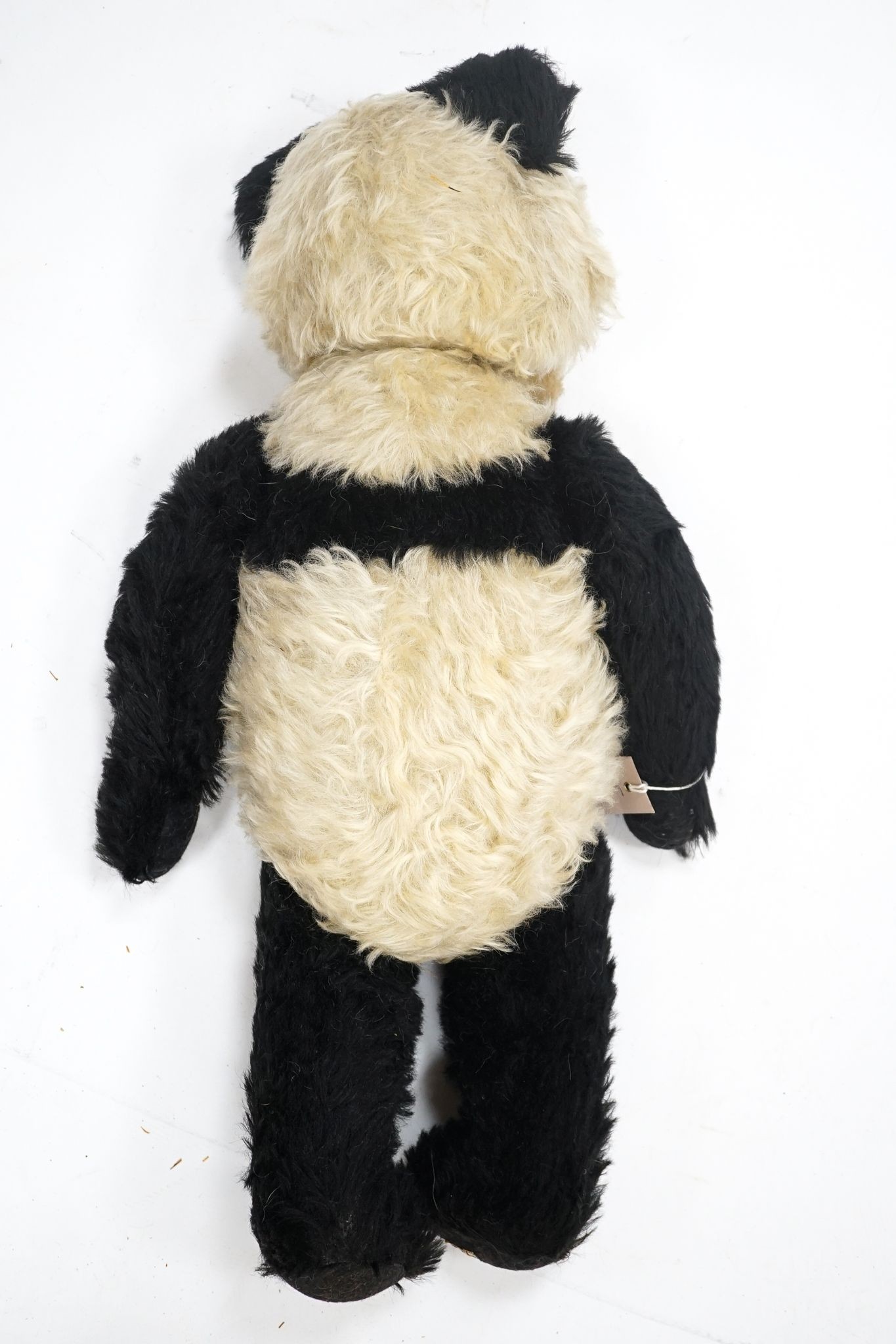 A Merrythought Panda 1930's Label Reg. Design, very good condition, slight thinning right side of tummy, 25in.